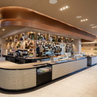 a food court with a counter and shelves